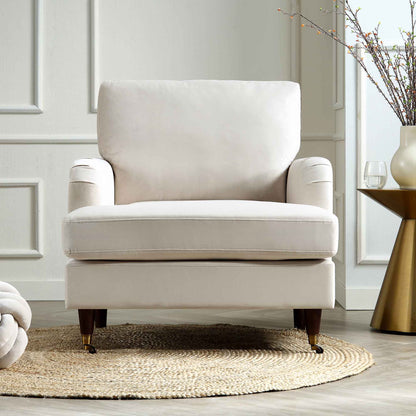 Fauteuil Brigette en velours beige avec pieds à roulettes en laiton antique