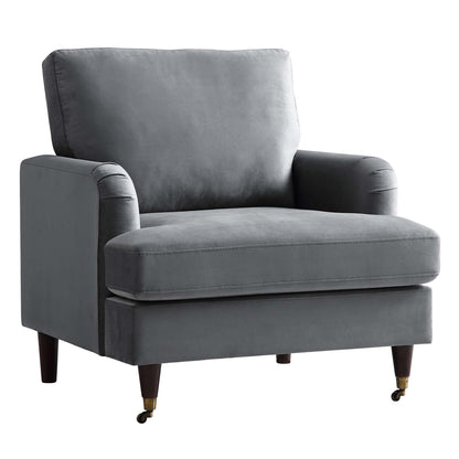 Fauteuil Brigette en velours gris avec pieds à roulettes en laiton antique