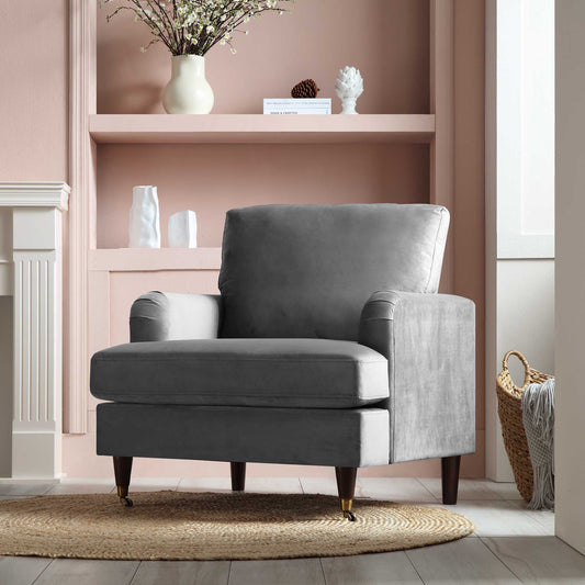 Fauteuil Brigette en velours gris avec pieds à roulettes en laiton antique