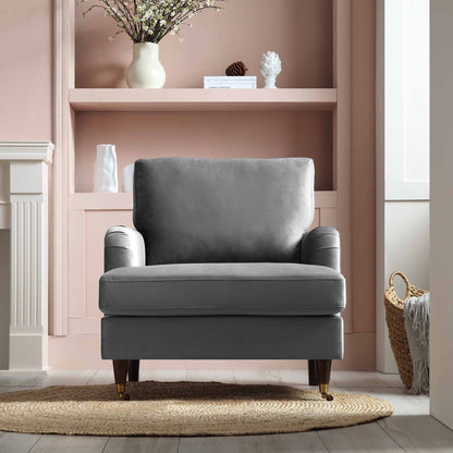 Fauteuil Brigette en velours gris avec pieds à roulettes en laiton antique