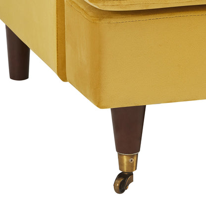 Canapé 2 places Brigette en velours moutarde avec pieds à roulettes en laiton antique