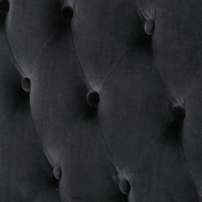 Canapé deux places à oreilles haut capitonné en velours noir
