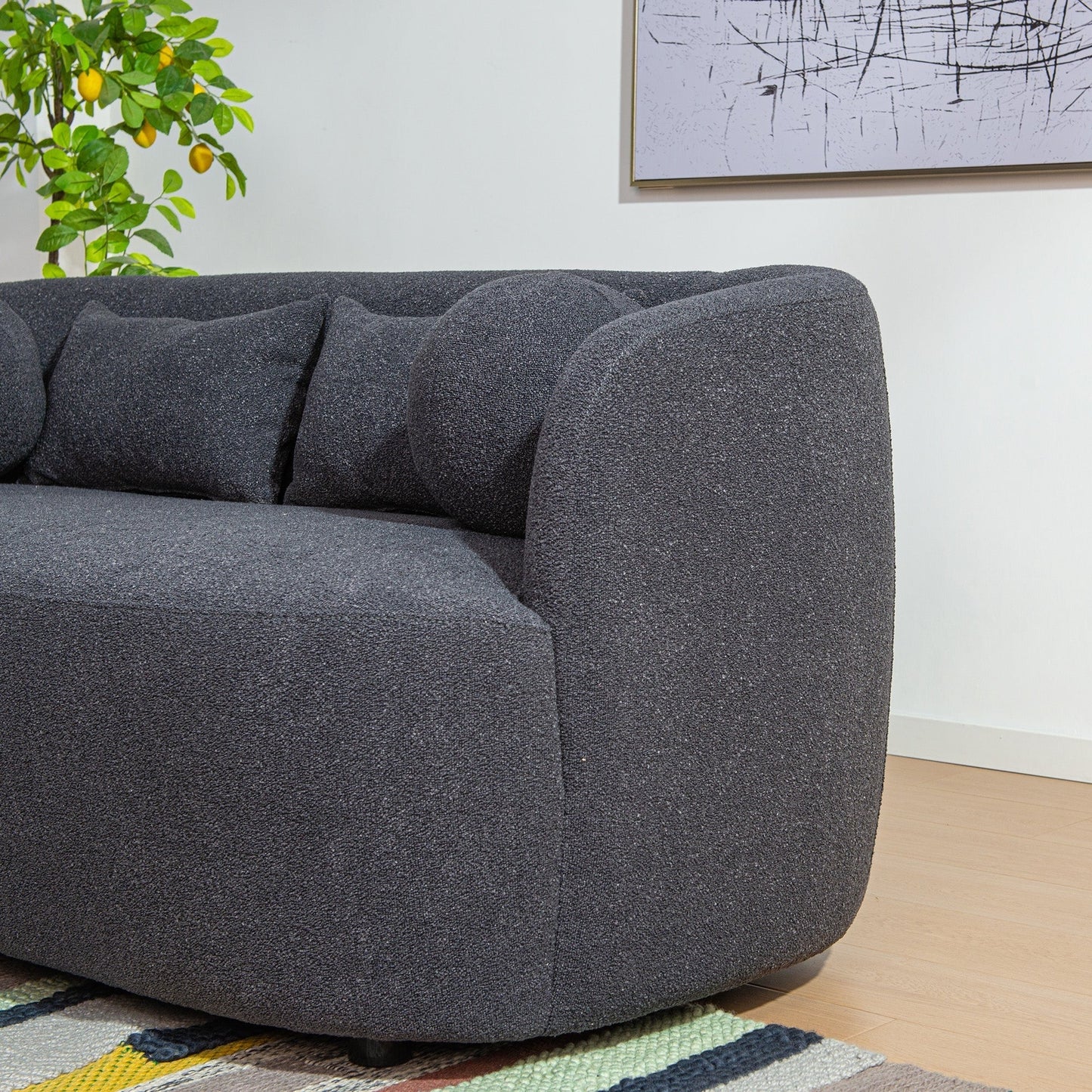 Canapé 2 places KINWELL en tissu bouclé avec coussins