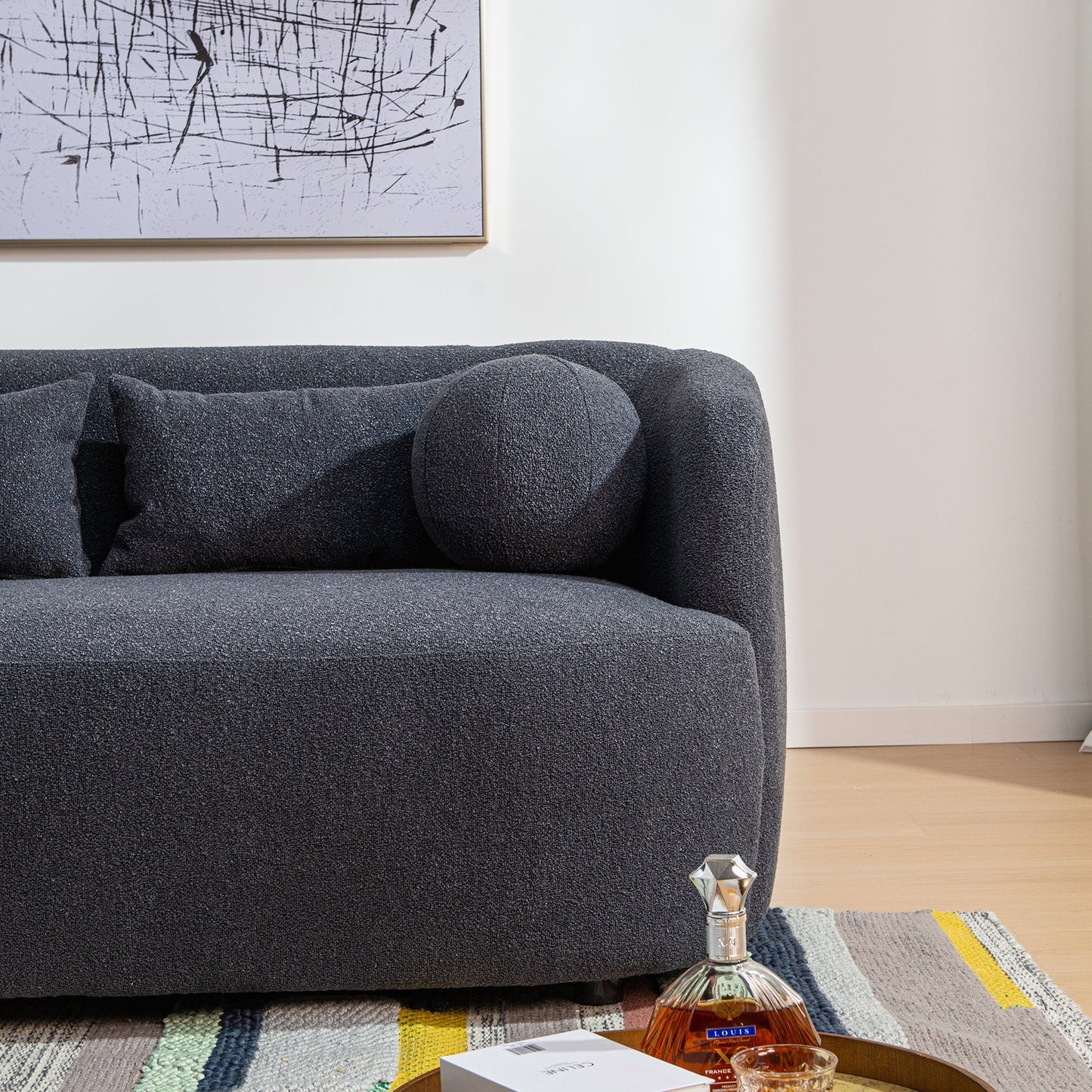 Canapé 2 places KINWELL en tissu bouclé avec coussins