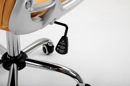 Fauteuil pivotant Chesterfield en velours moutarde