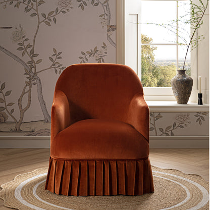 Fauteuil à jupe Calliope, velours rouille