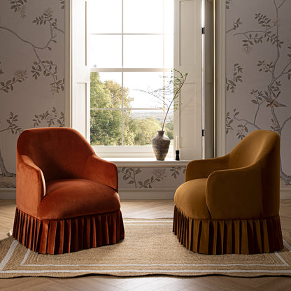 Fauteuil à jupe Calliope, velours rouille