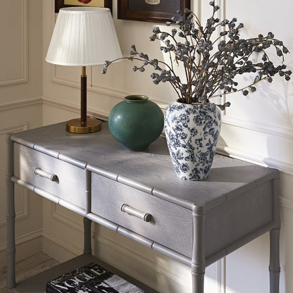 Console 2 tiroirs Elstowe en imitation bambou, gris chaud